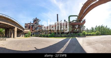 Disused blast furnace plant in Duisburg, Ruhr area district industry ruins with old bridge Stock Photo