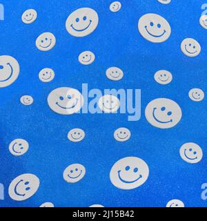 Photo background with happy smileys colorful. Smiling emoticons on blue background Stock Photo