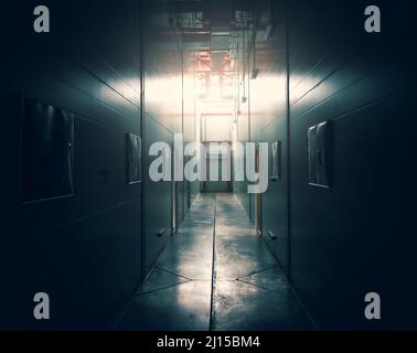 Dark corridor with closed door in end and light from window. Stock Photo