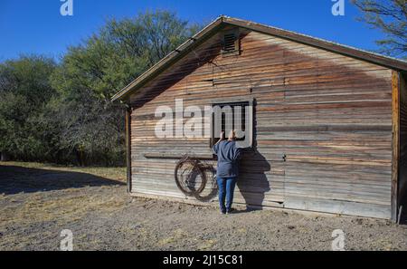 Peeking in the window of abandoned building in the ghost town Fairbank, Az Stock Photo