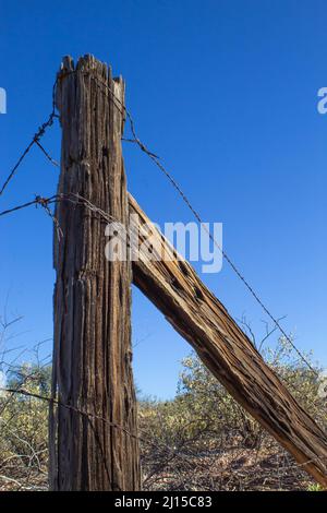 Fence post near abandoned Rail-Road outside of Hereford. Arizona Stock Photo