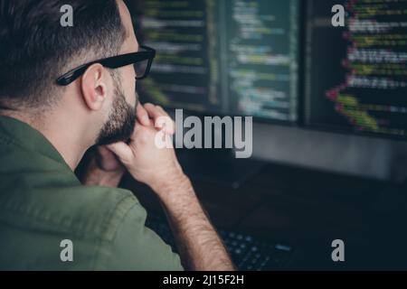 Profile side view portrait of attractive smart clever skilled guy solving task building process at workplace workstation indoors Stock Photo