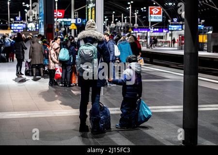 Berlin, Germany. 08th Mar, 2022. A Ukrainian mother and son stand on the platform at the Berlin Central Station. Since the war began, more than 3 million refugees have fled Ukraine. (Photo by Nicholas Muller/SOPA Images/Sipa USA) Credit: Sipa USA/Alamy Live News Stock Photo