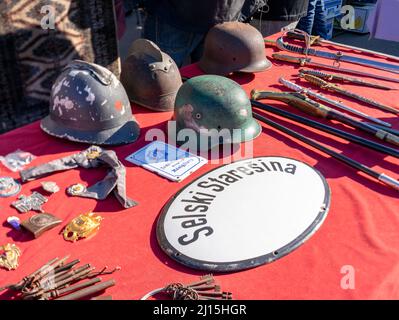 Old helms military antiques sold at the flea market at the Britanski Square, Britanski Trg, Zagreb, Croatia, Balkans Stock Photo