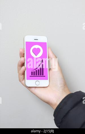 social media like screen on phone and like increase Stock Photo
