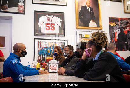 NASA astronaut Victor Glover speaks with students about his time aboard the International Space Station, Thursday, Nov. 18, 2021, at Ben’s Chili Bowl in Washington, DC. Students from Cardozo Educational Campus, Friendship Technology Preparatory High School, McKinley Technical High School, Phelps High School, and Wilson High School heard NASA astronauts Glover, Mike Hopkins, and Shannon Walker speak about the Crew-1 mission, the first crew rotation mission to the International Space Station for SpaceX’s Falcon 9 and Crew Dragon spacecraft as part of the agency’s Commercial Crew Program and the Stock Photo