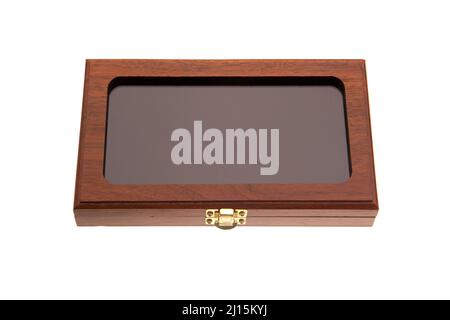 A small wooden box with a transparent glass lid and a metal latch. Luxury packaging for a gift. Isolate on a white background. Stock Photo
