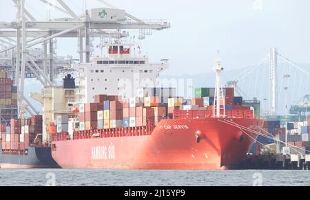 Oakland, CA - Feb 14, 2022: HAMBURG SUD cargo ship CAP JERVIS loading at the Port of Oakland, the fifth busiest port in the United States. Stock Photo