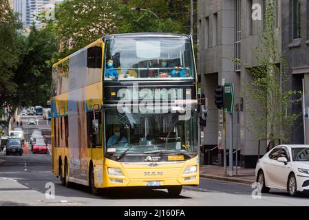 A double decker yellow, B-Line bus making its way from central Sydney to Mona Vale Beach in New South Wales, Australia Stock Photo