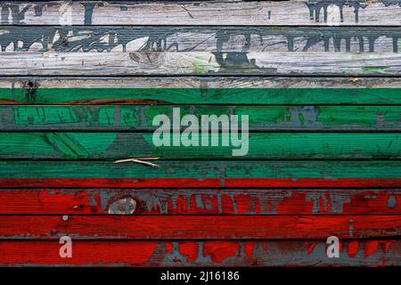 The national flag of Bulgaria is painted on uneven boards. Country symbol. Stock Photo