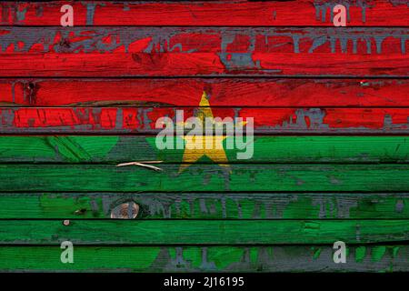 The national flag of Burkino Faso is painted on uneven boards. Country symbol. Stock Photo