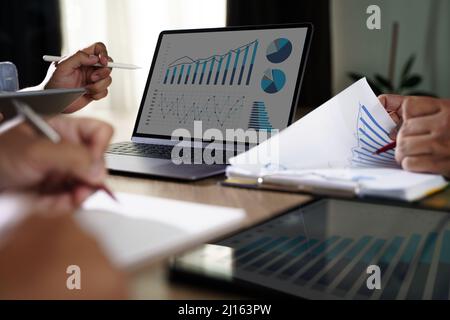 Business team discussing working analyzing with financial data strategy business plan for investment, finance analysis concept Stock Photo