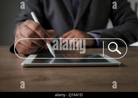 Businessman holding a smartphoneSearching for information Search Technology Search Engine Optimization data Stock Photo
