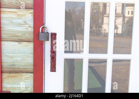 Close up shot of a door locked with a padlock Stock Photo
