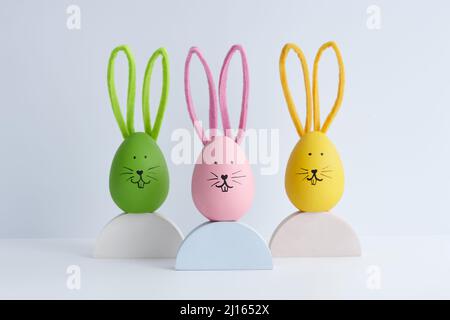 Colorful Easter eggs with bunny faces, holiday decoration Stock Photo
