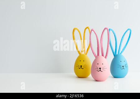 Colorful Easter eggs with bunny faces, holiday decoration Stock Photo