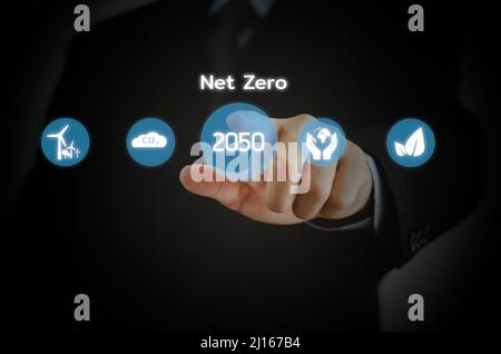 Businessman touching net zero virtual screen Internet Business Technology Concept. Stock Photo