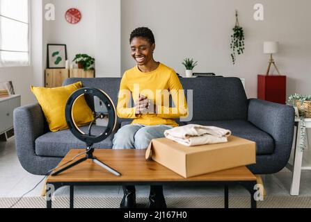 Young african woman social media influencer recording video for her blog Stock Photo