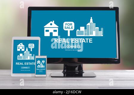 Real estate concept shown on different information technology devices Stock Photo