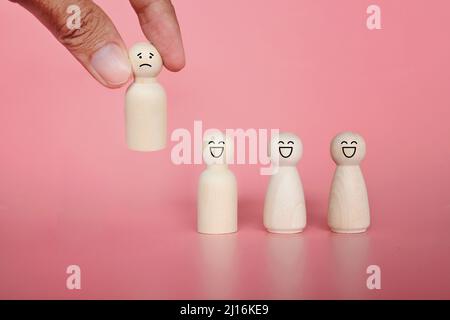 Firing, bad employee and demotion concept. Hand pick red wooden cube ...