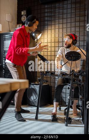 Men playing electric drums at home sstudio Stock Photo