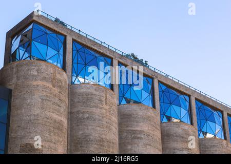 Cape Town, South Africa, 26th February - 2022: Angular glass facade of grain silo building turned into apartments. Stock Photo
