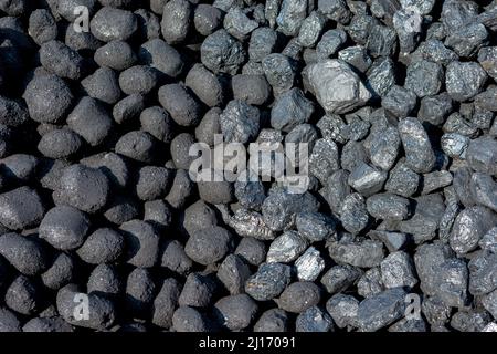 Two coal piles blended together at a Heritage Steam Railway. New Compressed Anthracite Ovoids on the left & Welsh steam lump coal on the right. Stock Photo