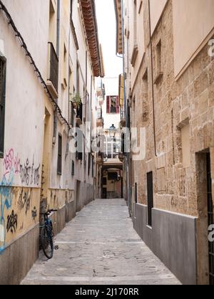 Palma de Mallorca, Spain; March 22nd 2022: Old town of Palma de Mallorca narrow street Stock Photo