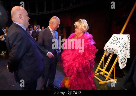 Chief Executive of the Grand Opera House Belfast, Ian Wilson (left) with the Prince of Wales and drag queen May McFettridge (right) at the re-opening of the Grand Opera house, Belfast, on the second day of his two-day visit to Northern Ireland. Picture date: Wednesday March 23, 2022. Stock Photo