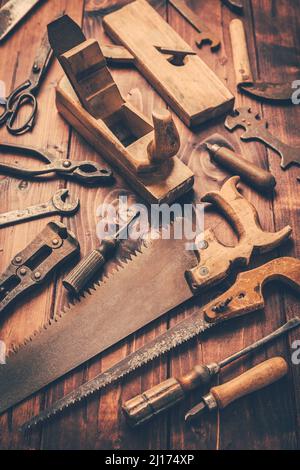 Assortment of old and rusty tools in workshop in vintage look Stock Photo