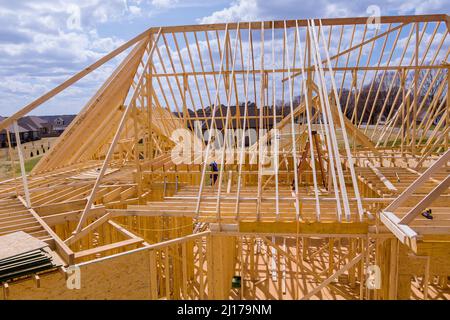 Residential house with wooden frame under construction house installation the roof of the house