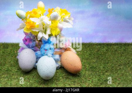 Stuffed bunnies holding three large eggs sitting under a bouquet of spring flowers. Stock Photo