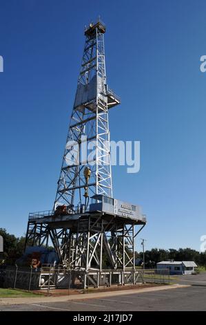 The Parker Drilling Company Rig 114 towers over Elk City, OK.Once one of the world's tallest rigs, it was used in the oil, gas and nuclear industries. Stock Photo