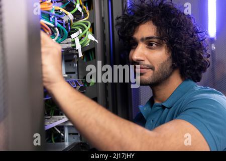 IT professional analyzing network server in industry Stock Photo