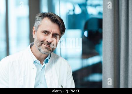 Smiling doctor at hospital Stock Photo
