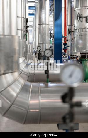 Pressure gauge on the pipe of craft brewing equipment in a brewery ...