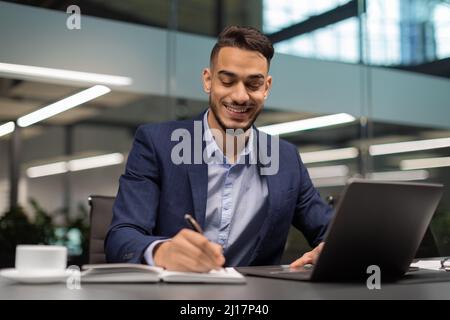 Successful middle eastern businessman working at modern office Stock Photo