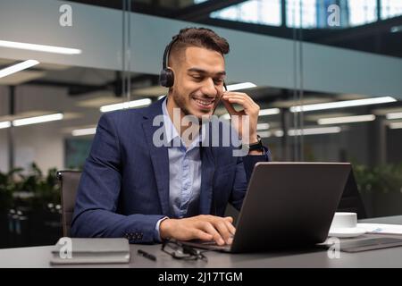 Cheerful arabic entrepreneur having video call with business partners Stock Photo