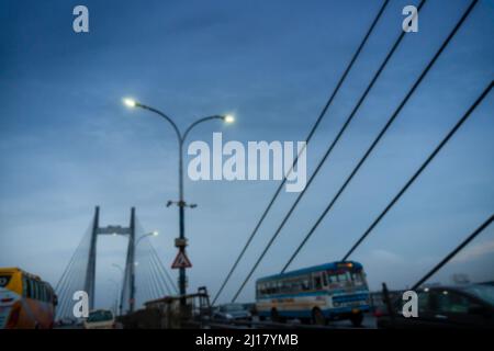 Blurred image of Howrah, West Bengal, India. 2nd Hoogly bridge, vidyasagar setu at blue hour. Monsoon stock image. Stock Photo