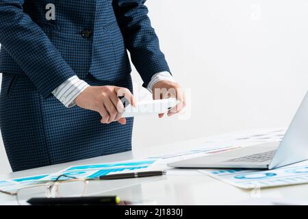 Businesswoman doing photo of document Stock Photo