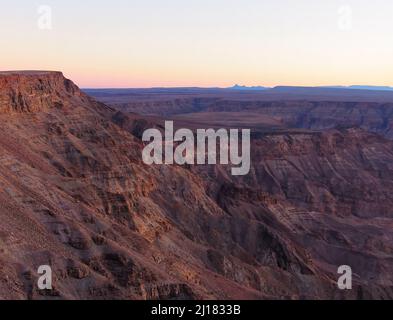 An aerial shot of a sunset over a fish river canyon in Namibia Stock Photo