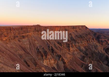 An aerial shot of a sunset over a fish river canyon in Namibia Stock Photo
