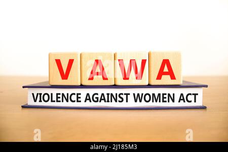 VAWA violence against women act symbol. Concept words VAWA violence against women act on cubes. Beautiful white background. Business, motivational VAW Stock Photo
