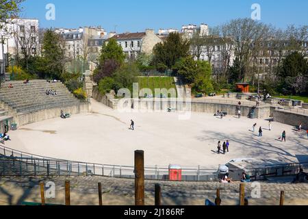 People gathering together in different spots at lunchtime in the Arènes de Lutece, a Roman coliseum dating back to the 1st century AD, Paris, France. Stock Photo