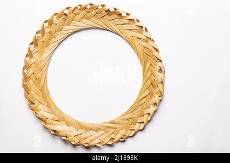 Weaved circular frame made from bamboo tree. Isolated in White background with copy space. Stock Photo