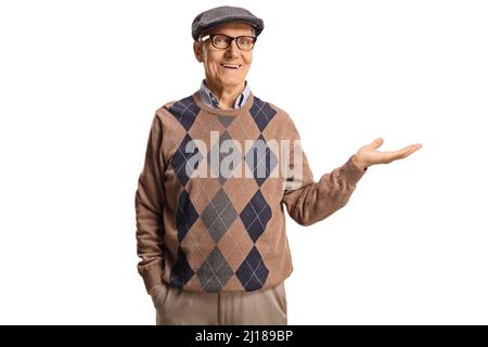 Elderly man holding something imaginary in his hand and smiling isolated on white background Stock Photo