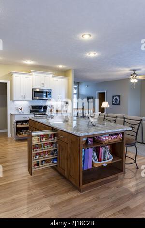 A classic kitchen with functional island on wooden floor Stock Photo