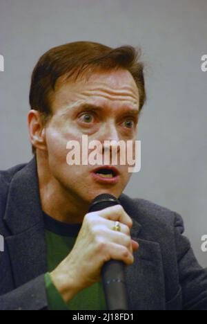 American voice actor comedian, impressionist & musician, Billy West,  demonstrating the facial expressions accompanying the voice of Futurama's Nixon. Stock Photo