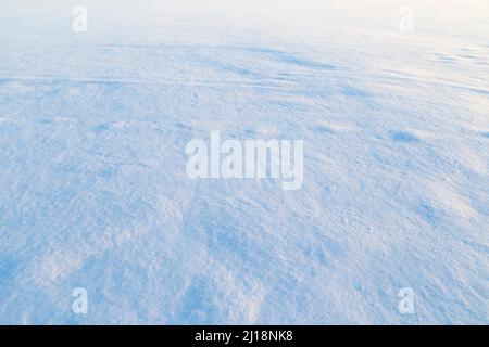 Close-up of fresh shiny snow on the ground on a sunny day. Good as a winter season background. Stock Photo