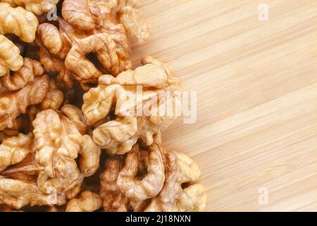 Close up picture of walnuts on a wooden background, selective focus. Stock Photo